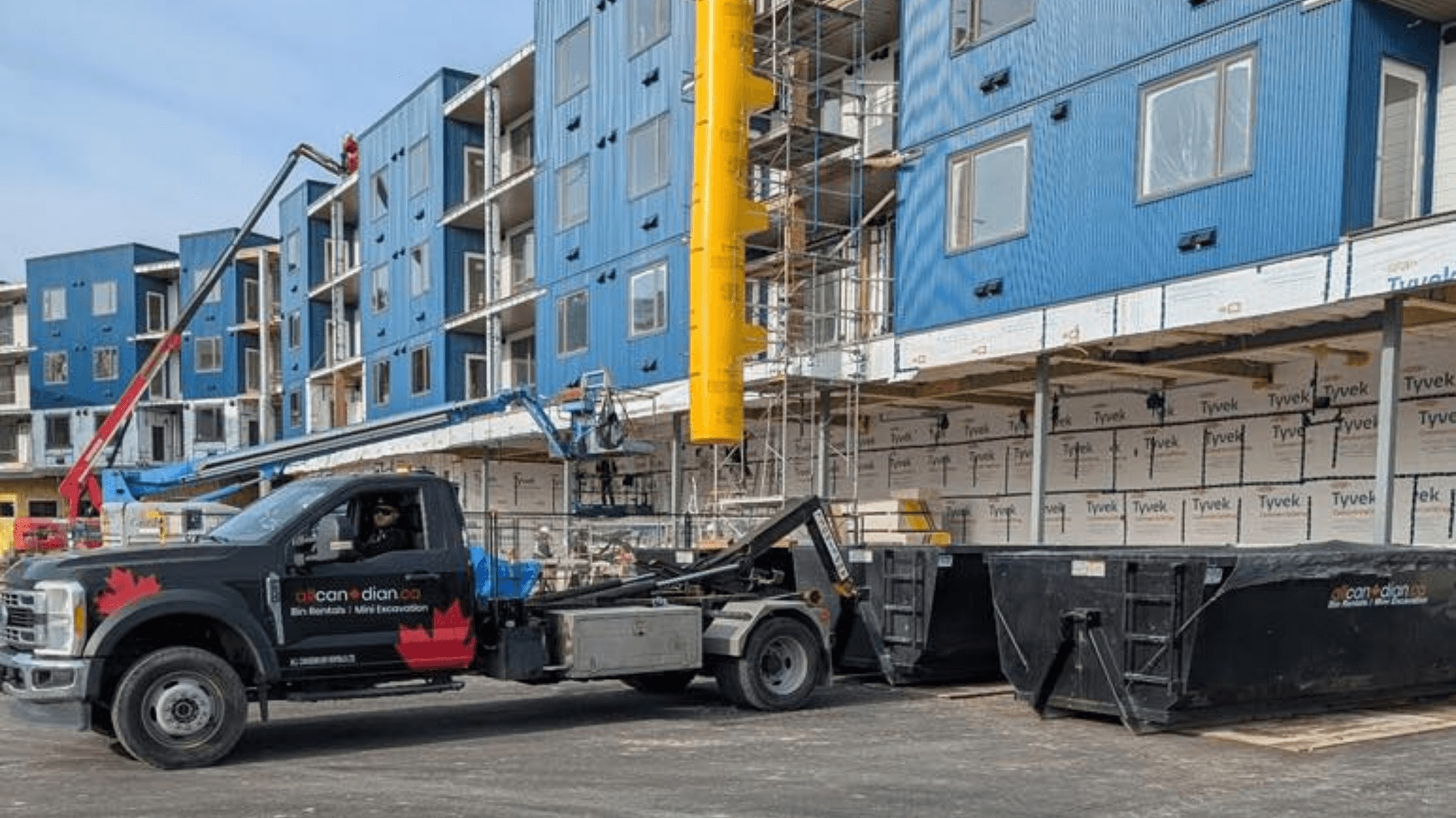 Renovation drywall being removed and loaded into a bin in Parksville BC